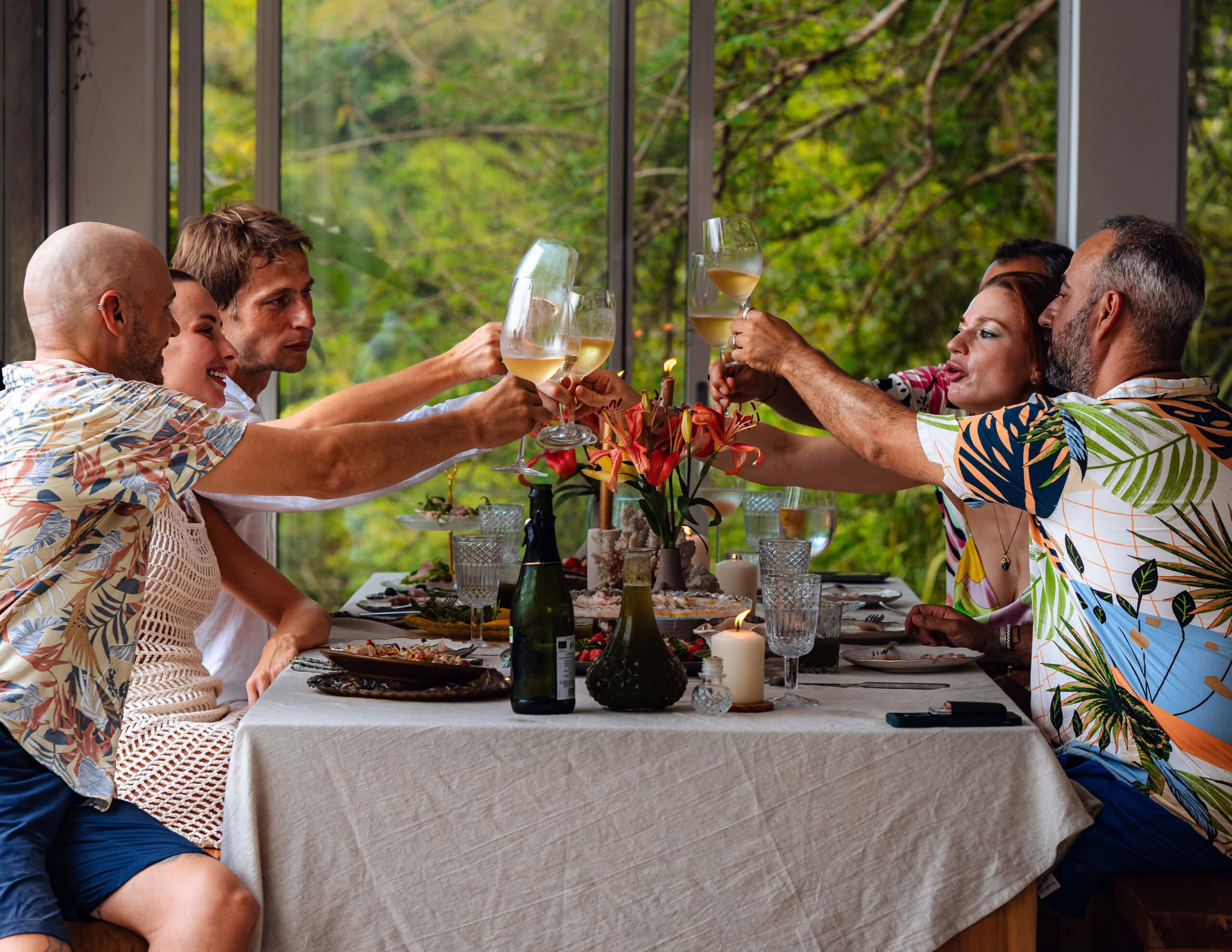Group of friends celebrating with wine at a destination wedding in Manzanillo.